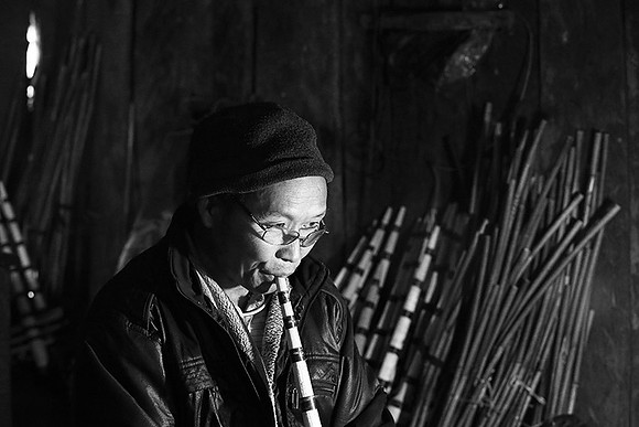 Man making traditional musical instruments