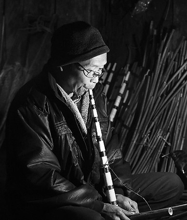 Man making traditional musical instruments