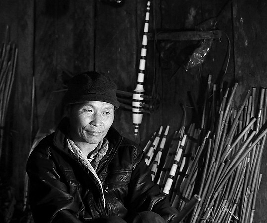 Man making traditional musical instruments