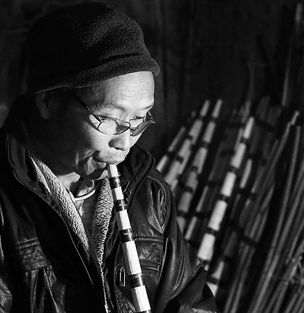 Man making traditional musical instruments