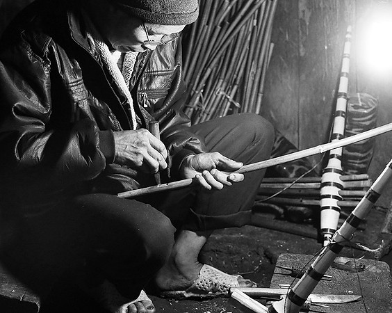 Man making traditional musical instruments